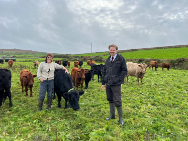 Derek with a cow